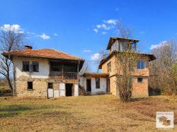 Large plot of land with two houses and a barn in the village of Voynezha