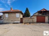 Two-story house with a garage, flat yard, BBQ and outbuildings in the village of Dragijevo