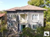 A two-story house with a stone barn and a flat yard in the village of Gorna Lipnitsa